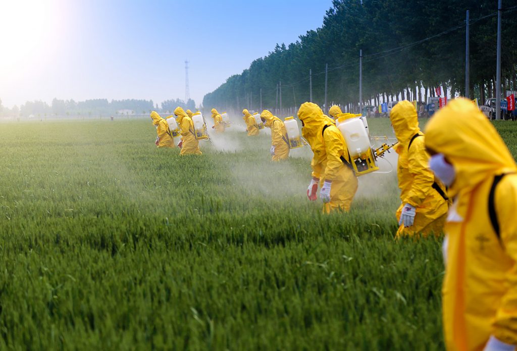 Farmers Spraying Pesticide